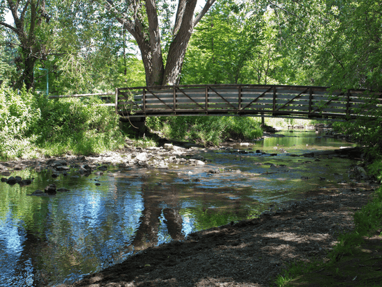 A wooden bridge crossing over the creek