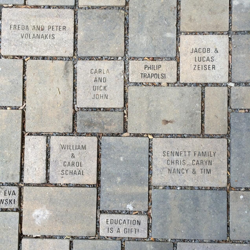 Pavers with the names of people who have given donations.