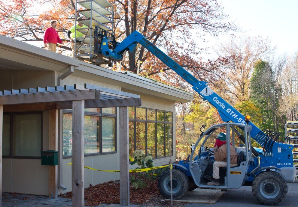 Green Roof being build by construction workers.