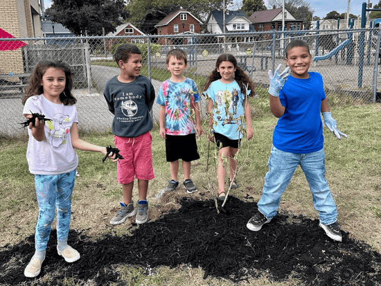 Five children from Erie County planting a tree