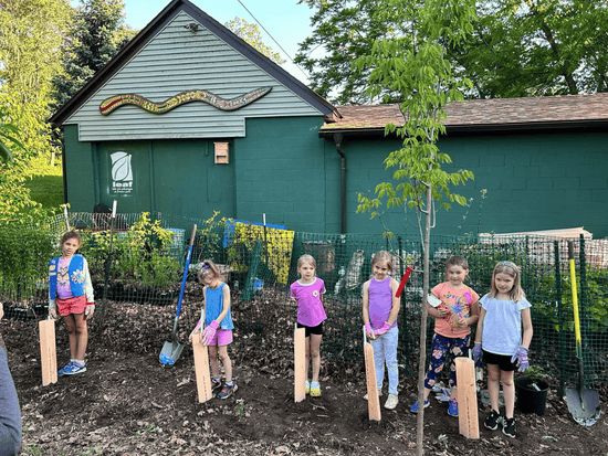 Six children from Erie County planting a tree